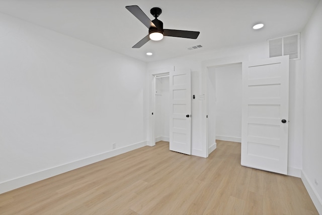 unfurnished bedroom with ceiling fan, a closet, and light hardwood / wood-style floors