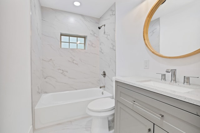 full bathroom with vanity, tiled shower / bath combo, and toilet