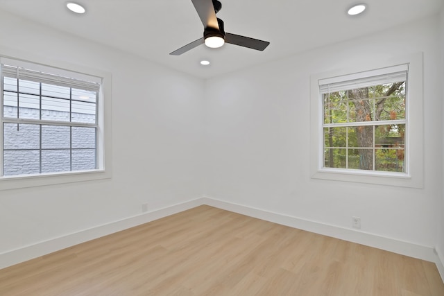 unfurnished room featuring ceiling fan and light hardwood / wood-style flooring