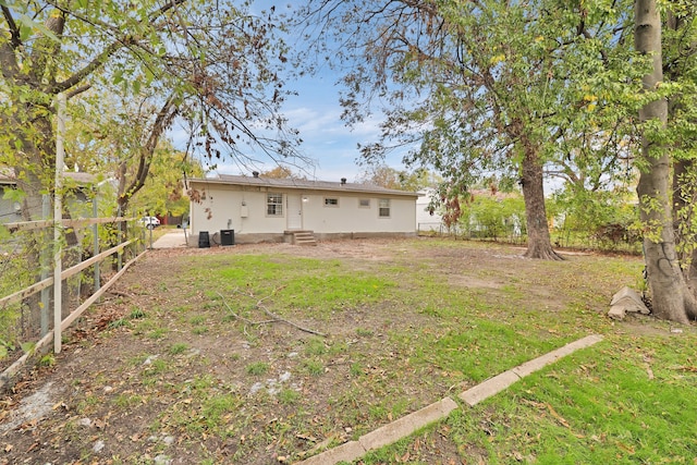 back of property with central air condition unit