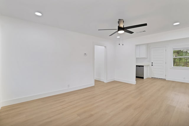 unfurnished living room with ceiling fan and light wood-type flooring