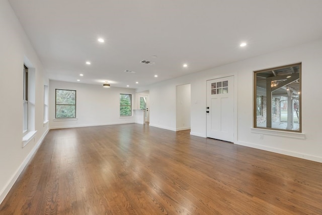 kitchen featuring white cabinets, sink, dark hardwood / wood-style floors, appliances with stainless steel finishes, and tasteful backsplash