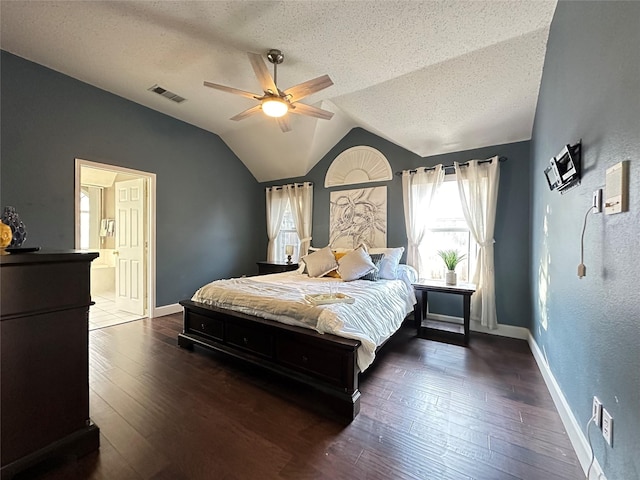 bedroom featuring a textured ceiling, dark hardwood / wood-style flooring, vaulted ceiling, and ceiling fan