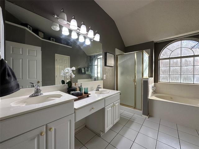 bathroom featuring tile patterned flooring, vanity, lofted ceiling, and independent shower and bath