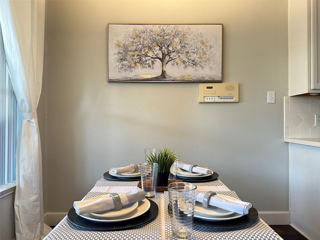 dining room with hardwood / wood-style flooring