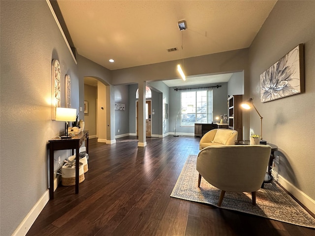 living area with dark hardwood / wood-style flooring