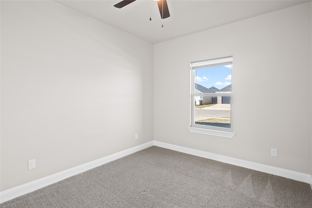 unfurnished room featuring ceiling fan and carpet floors