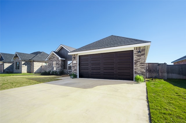 view of front of home featuring a garage and a front lawn