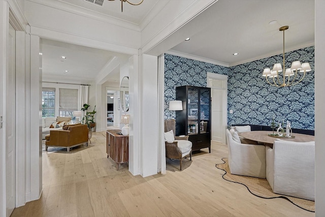 interior space featuring wallpapered walls, wood-type flooring, an inviting chandelier, crown molding, and recessed lighting