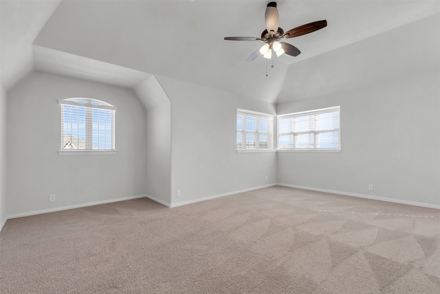 bonus room with ceiling fan, light colored carpet, and vaulted ceiling