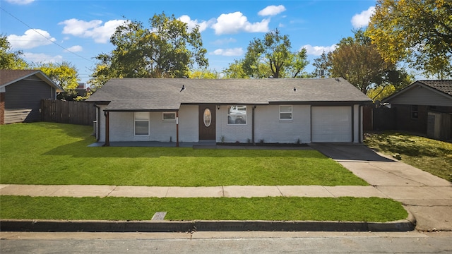 view of front of house featuring a garage and a front yard