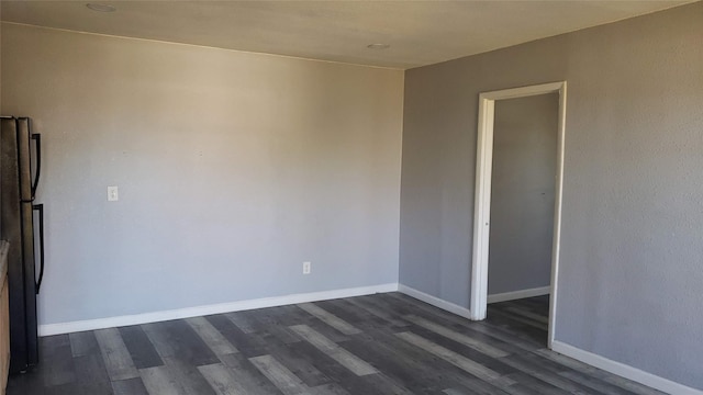2517 Glencrest Dr, Fort Worth, TX 76119 - unfurnished room featuring dark wood-style flooring and baseboards