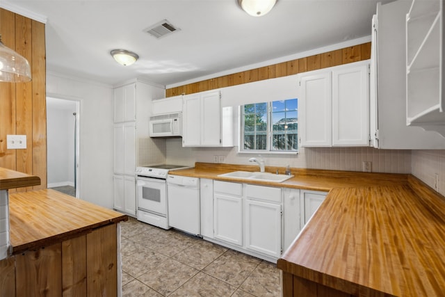 kitchen featuring white cabinets, white appliances, ornamental molding, and sink