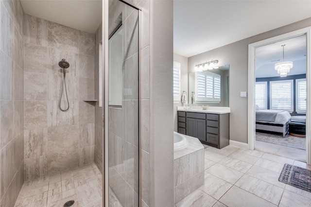 bathroom with vanity, plus walk in shower, and a notable chandelier