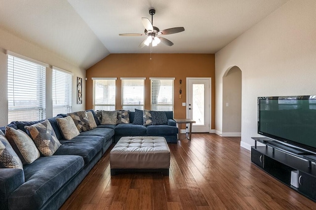 living room with ceiling fan, plenty of natural light, dark wood-type flooring, and lofted ceiling