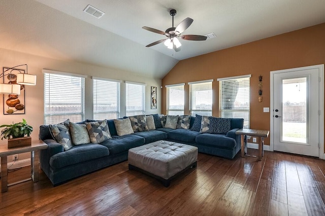 living room featuring lofted ceiling, dark wood-type flooring, and ceiling fan