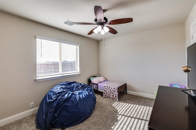 bedroom with ceiling fan and carpet