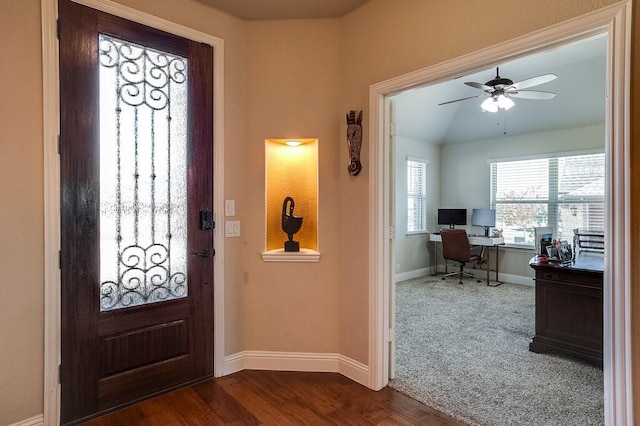 entryway with ceiling fan, lofted ceiling, and hardwood / wood-style floors