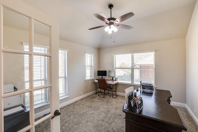 office space featuring carpet flooring, ceiling fan, and vaulted ceiling