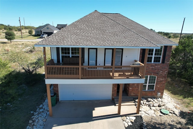 135 Coghill Dr, Possum Kingdom Lake, TX 76449 - back of property featuring a garage and covered porch