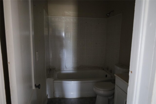 full bathroom with vanity, toilet, and tiled shower / bath combo