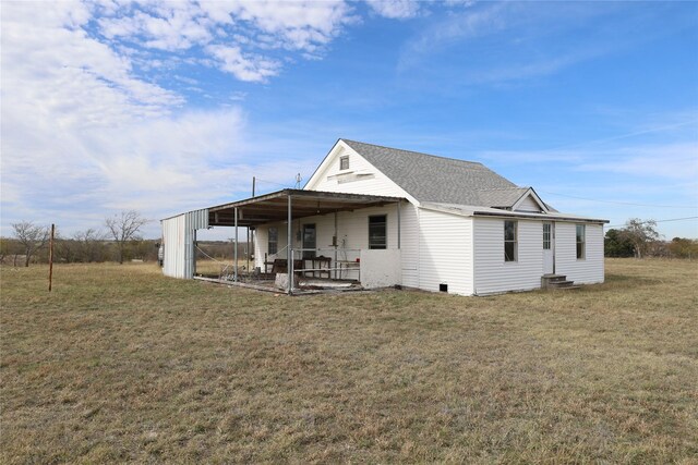 exterior space with an outbuilding and a yard