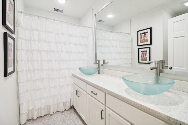 bathroom with vanity and tile patterned floors