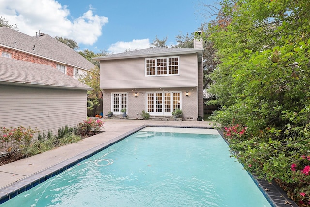 rear view of property featuring a patio and french doors