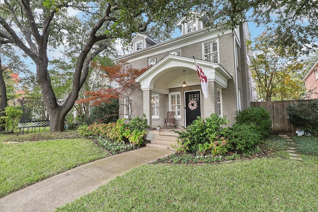 view of front of home featuring a trampoline and a front lawn