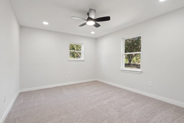 empty room featuring carpet flooring and ceiling fan