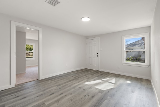 unfurnished room featuring light hardwood / wood-style floors