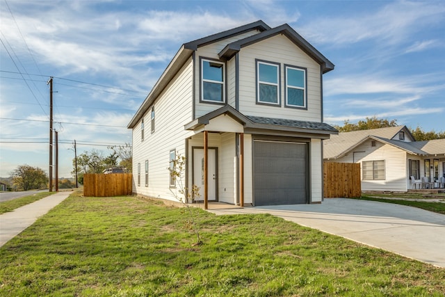 view of front of property featuring a garage and a front lawn