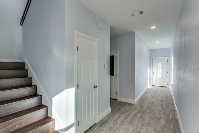 hallway with light wood-type flooring