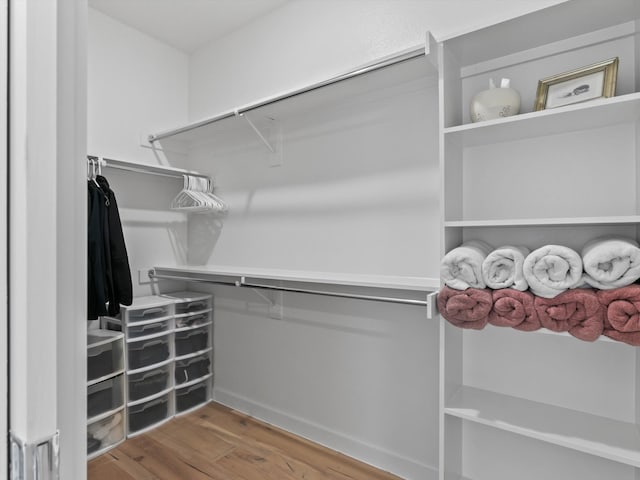 walk in closet featuring hardwood / wood-style floors