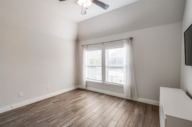 unfurnished room with hardwood / wood-style floors and ceiling fan