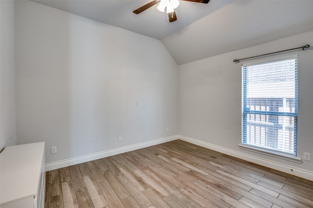 unfurnished room featuring light hardwood / wood-style floors, ceiling fan, and lofted ceiling