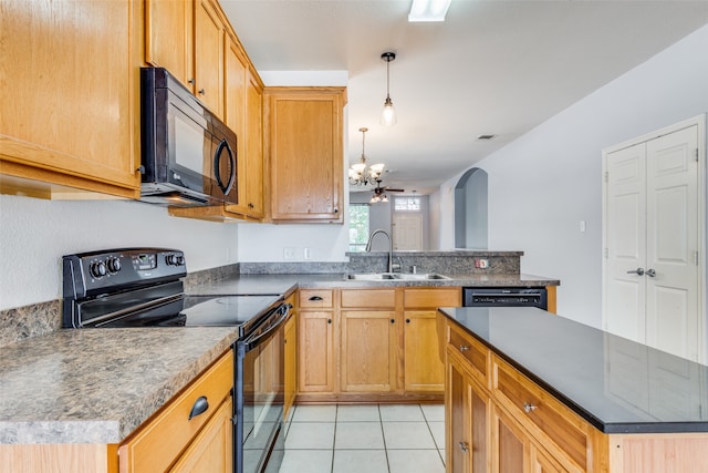 kitchen with sink, black appliances, pendant lighting, a center island, and light tile patterned flooring