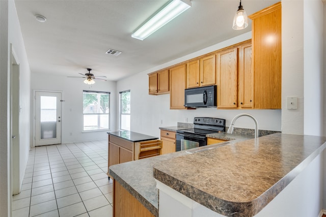 kitchen featuring ceiling fan, sink, kitchen peninsula, light tile patterned floors, and black appliances