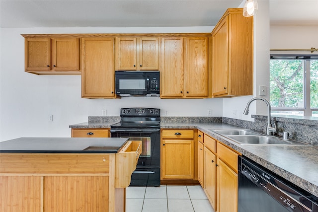 kitchen with sink, light tile patterned floors, and black appliances