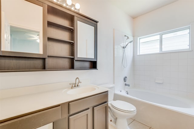 full bathroom featuring vanity, tile patterned floors, tiled shower / bath combo, and toilet