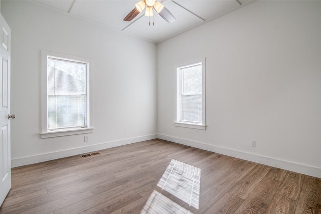 spare room with light hardwood / wood-style flooring and ceiling fan