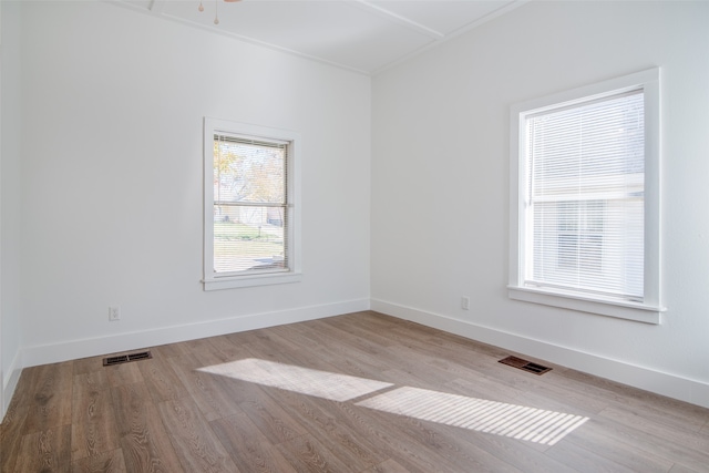 empty room with light hardwood / wood-style floors