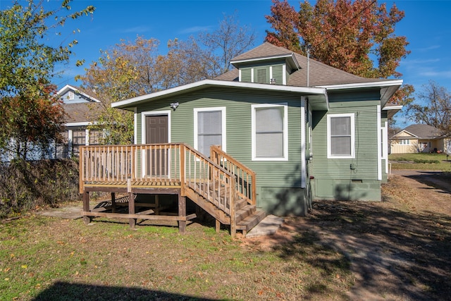 rear view of house with a deck