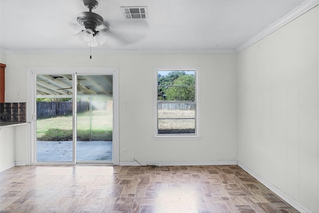 207 Brazos St, Hillsboro, TX 76645 - spare room with ceiling fan, ornamental molding, and baseboards