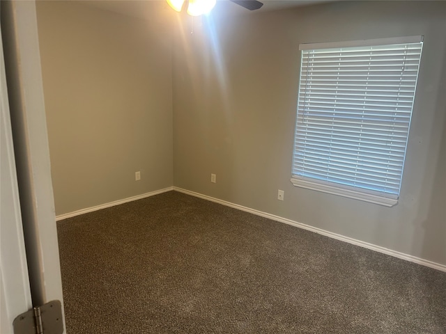 spare room featuring carpet flooring and ceiling fan