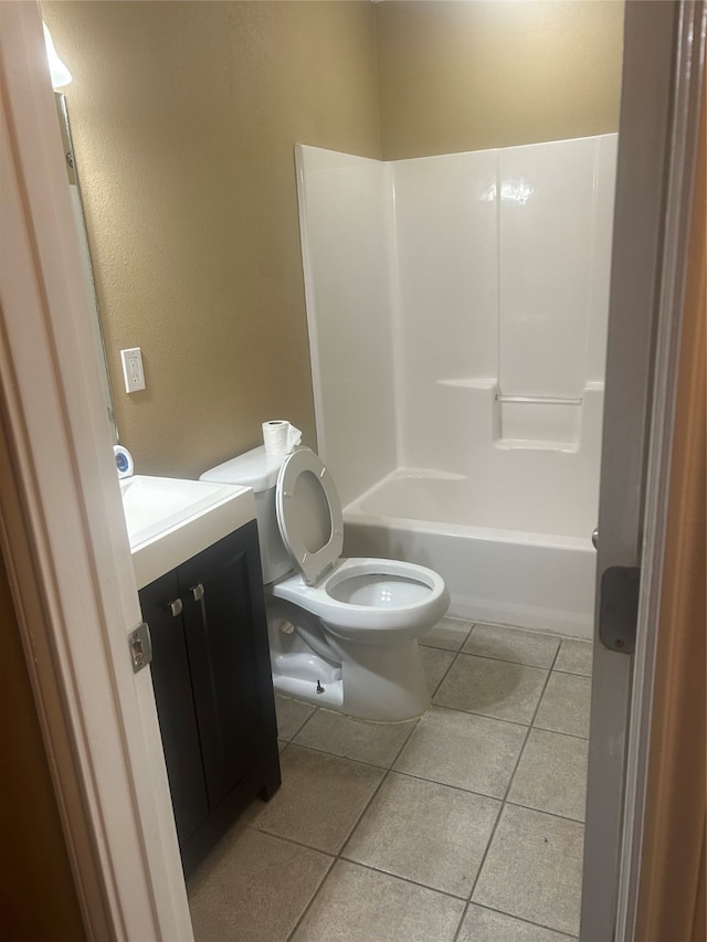 full bathroom featuring tile patterned flooring, vanity, toilet, and tub / shower combination