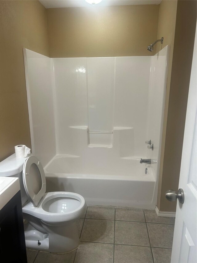 full bathroom featuring toilet, shower / bathing tub combination, vanity, and tile patterned floors