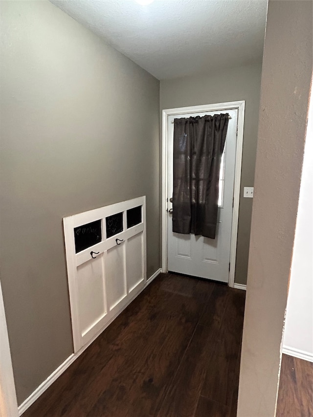 doorway to outside featuring dark hardwood / wood-style floors