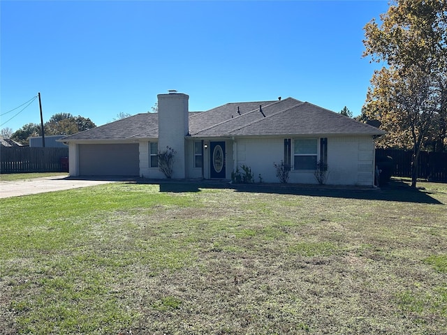 ranch-style home with a garage and a front lawn