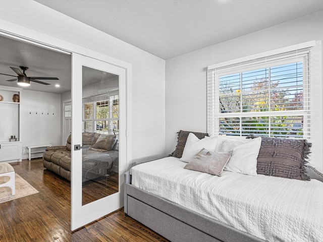 bedroom featuring dark wood-type flooring and french doors